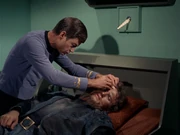 Mccoy applying a bandage