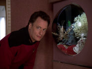 Q with Livingston, a lionfish kept by Picard in his ready room