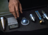 A thrombic modulator, medical tricorder, an unknown instrument, an exoscalpel, a hypospray, and a second unknown instrument