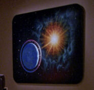 A painting in the Enterprise-D guest quarters and Riker's quarters (TNG: "Symbiosis", "Time Squared", "Up The Long Ladder", "Remember Me", "Night Terrors")