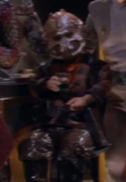 Another member at Quark's bar Played by John Tamaki (DS9: "Sanctuary")