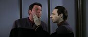 Data touches William T. Riker's clean shaven face