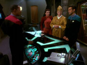 Sisko, Kira, Winn, and Bashir discuss Bareil