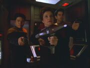 Harry Kim, Kathryn Janeway, and Ayala aim phasers