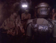 Breen guard and Kira Nerys in refrigeration suit