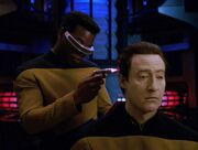 Geordi La Forge examines Data