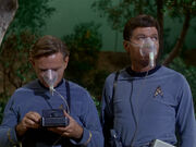 Leonard McCoy and Carl Jaeger wearing breathing masks