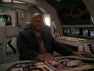 Benjamin Sisko operates the helm on a Starfleet runabout
