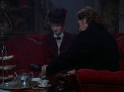 Doctor Pulaski and Professor Moriarty enjoy a cup of tea