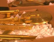 A gold casting of Playmates USS Enterprise-B