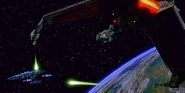 Duras sisters' Bird-of-Prey firing on the Enterprise-D.jpg (21 KB) ...as the Enterprise starts to rotate, the Bird-of-Prey fires back