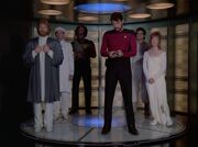 Riva and his chorus, Worf, and Riker beam down to Solais V
