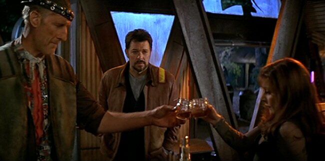 Deanna Troi and Zefram Cochrane toasting