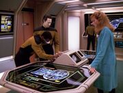 Geordi La Forge, Data, and Beverly Crusher in engineering