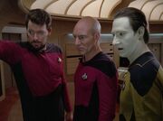 Riker, Picard, and Data examine the energy vortex