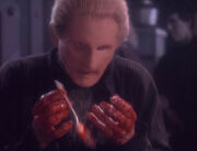 Odo's hands covered in blood