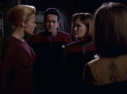 Seven, Torres, and Janeway talk about an unusable coil