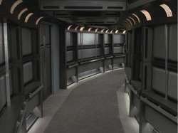 A corridor on board a starship of the Intrepid-class