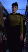 In a corridor/In the airlock Played by an unknown actress (TNG: "11001001")