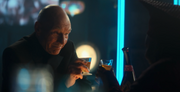 Guinan and Picard share a drink