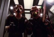 Krem and Muk wearing gas masks