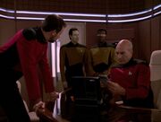 Riker, Data, La Forge, and Picard discuss the blockade