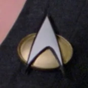 Starfleet combadge, 2364.jpg (35 KB) A black-bordered combadge (2350s to early 2365)