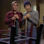 Kirk and Spock sweeping the floor