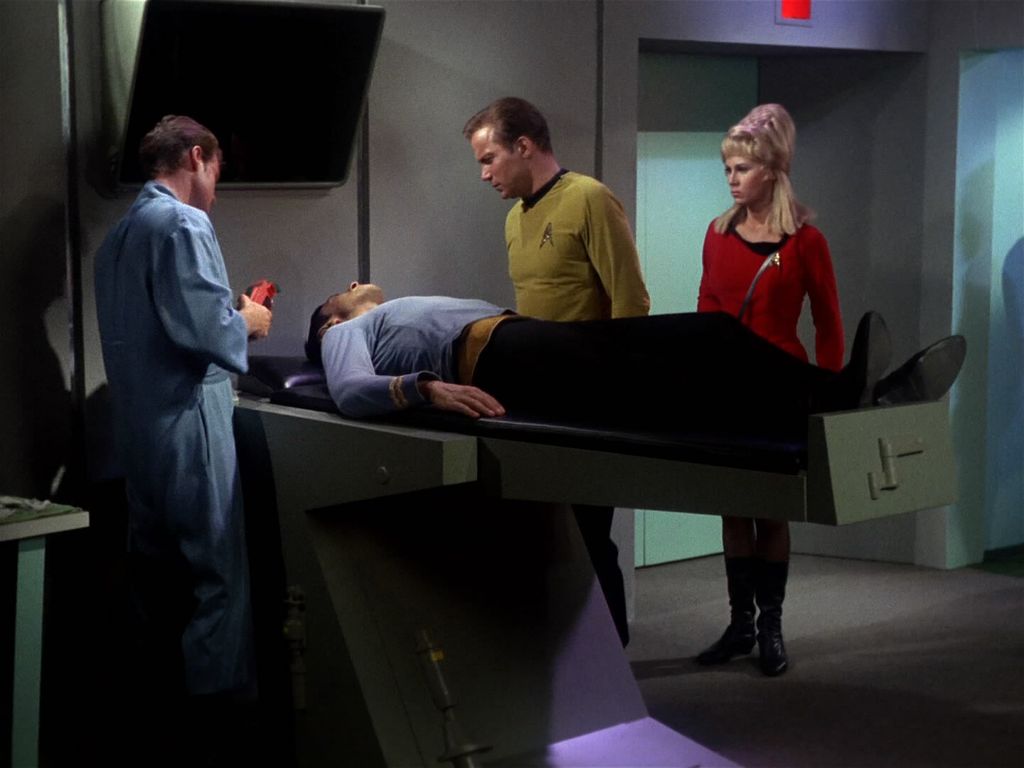 Leslie helping in sickbay