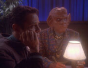 Bashir and Quark listen to Vic