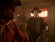 Worf talks to Frank Hollander in the saloon