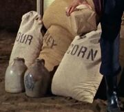 Sacks of flour, barley, and corn