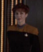 Female DS9 officer watching Quark