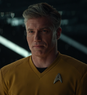 Captain Christopher Pike in a command gold uniform