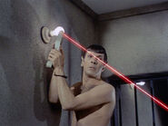 ...as he takes aim with a makeshift rubindium laser cutting torch.