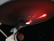 USS Enterprise fires photon torpedo