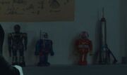 Action figures and a toy rocket ship