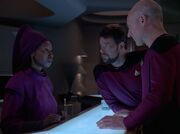 Guinan warns Picard and Riker to head back