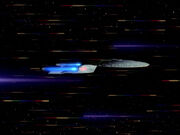 USS Enterprise going to warp in full profile