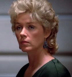 In a corridor Played by Natalia Silverwood (TNG: "Where No One Has Gone Before", "11001001")