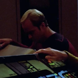 At the conn station Played by an unknown actor (TNG: "The Last Outpost")