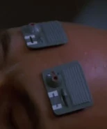 Two devices placed on the forehead