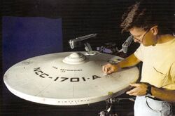 1991: Applying battle damage onto the refit Constitution II-class studio model Star Trek VI: The Undiscovered Country