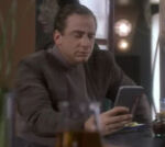 Promenade patron reading a PADD