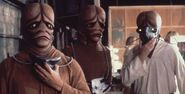 Three Zaranite-playing background performers