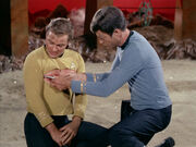 McCoy injects Kirk with neural paralyzer