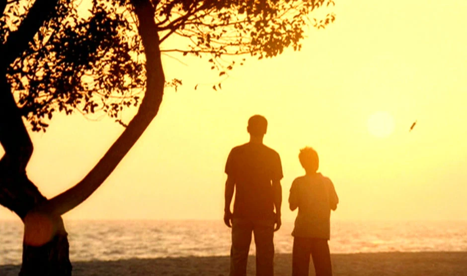 Henry Archer and son on the beach