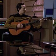 Data playing guitar