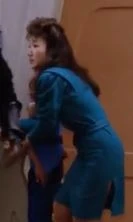 In a corridor Played by an unknown actress (TNG: "Heart of Glory")