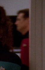 Command division officer in corridor, 2370